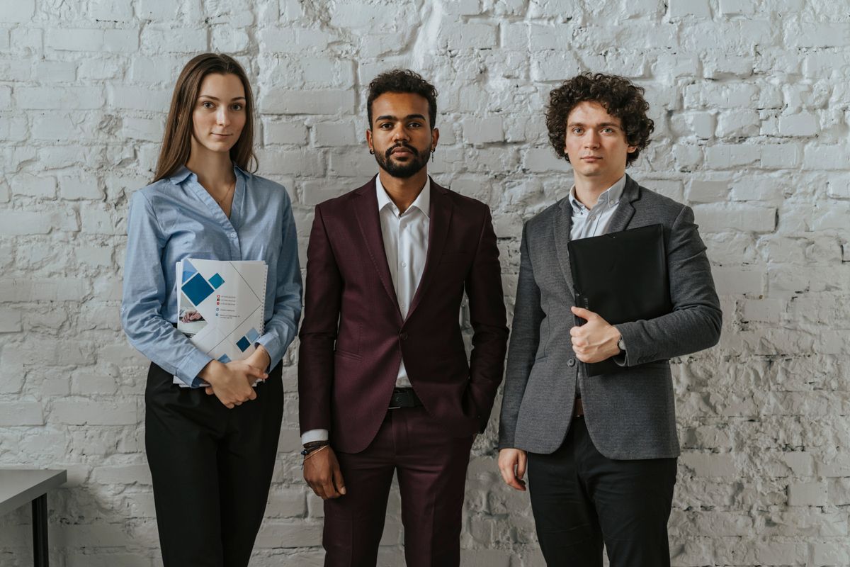 Three young professionals standing together