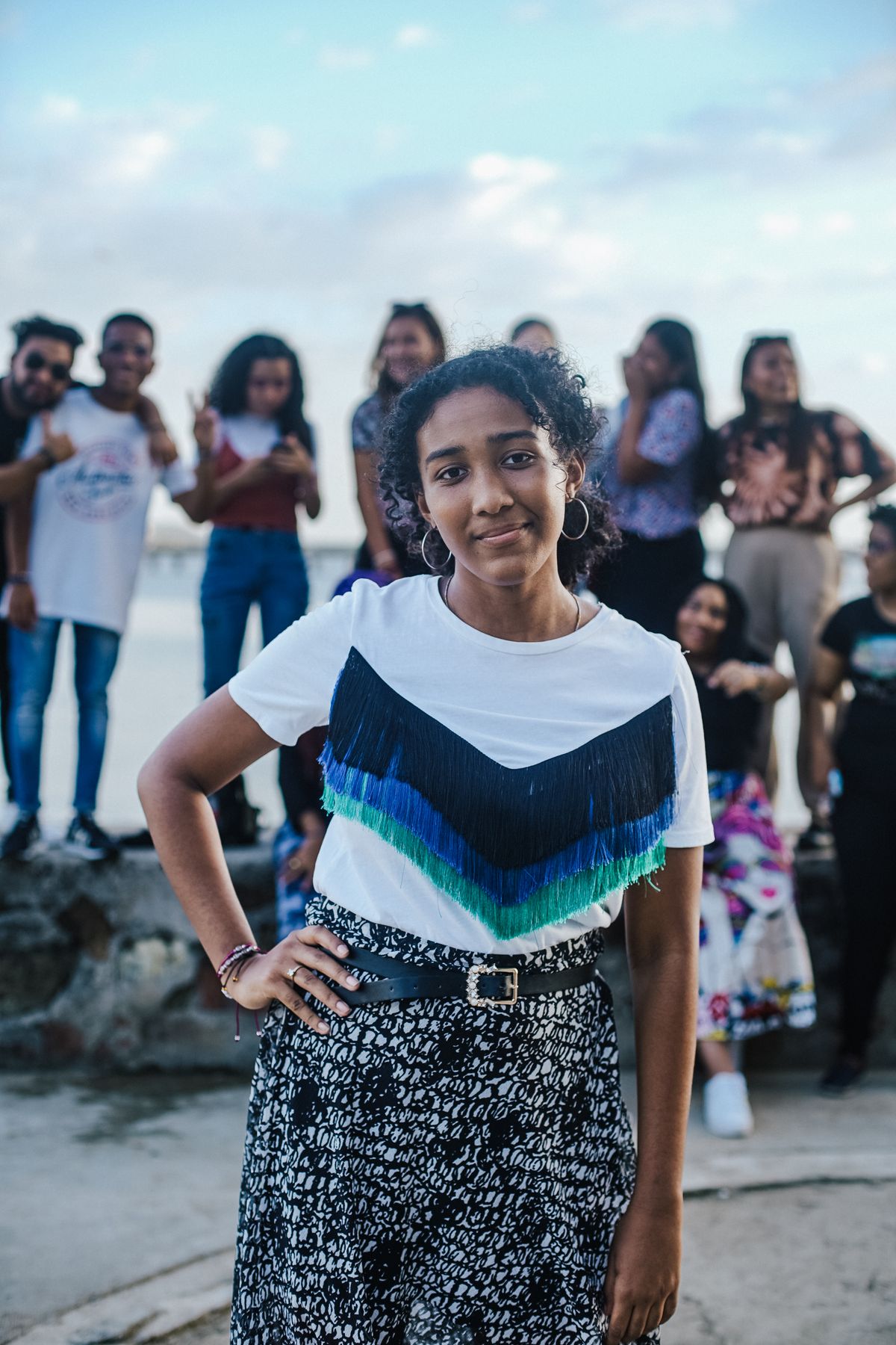 A group of joyful young people gathered outdoors